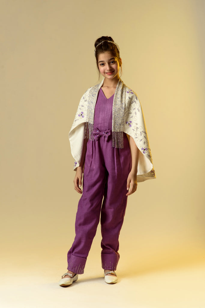Moonbeam Glimmer is an Organic Herringbone Jumpsuit With Embroidered Cape Shawl and Bow Belt For Girls.
