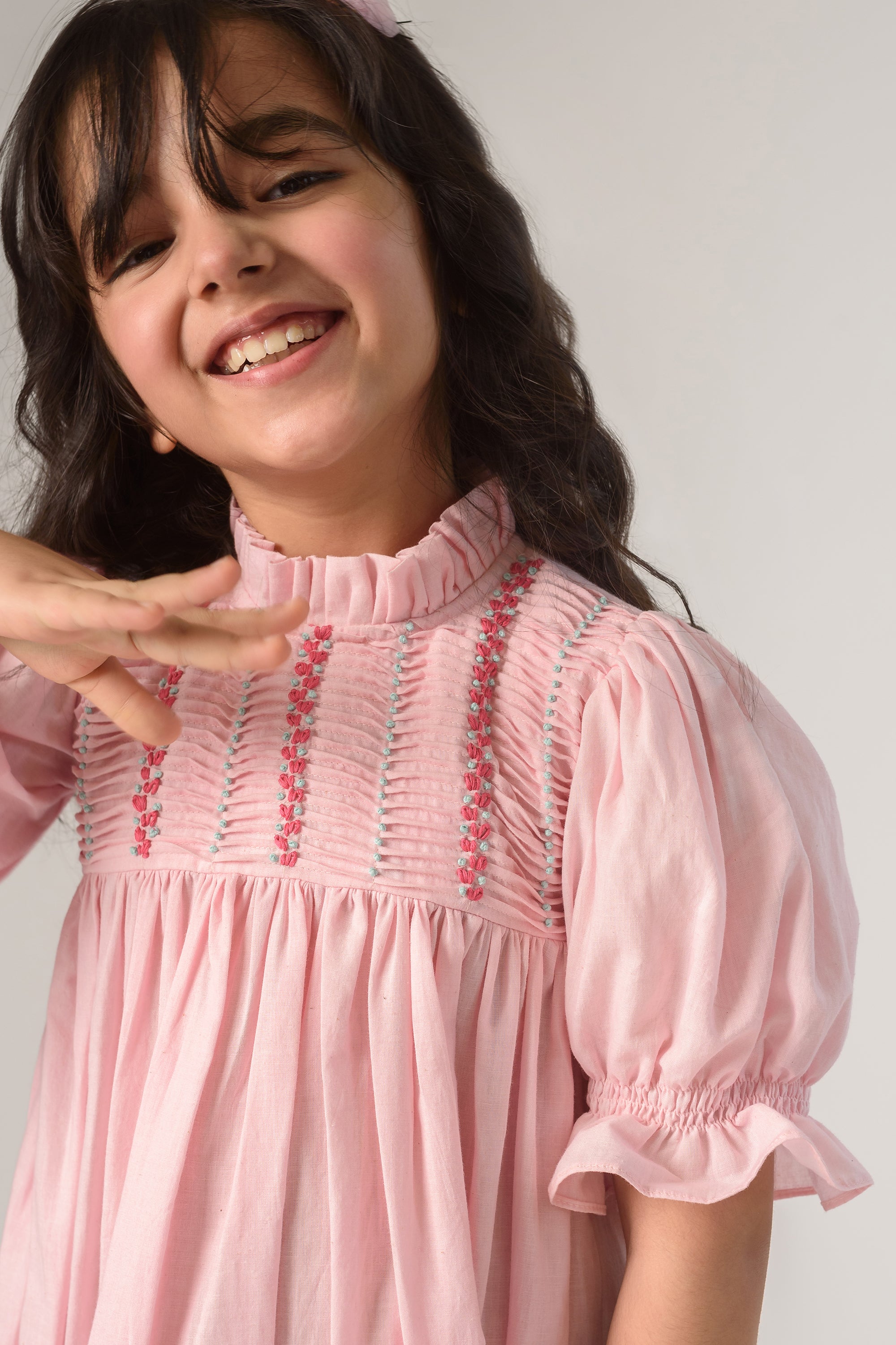 Valley of Flowers is a Thread Embroidered Organic Cotton Pink Dress For Girls.
