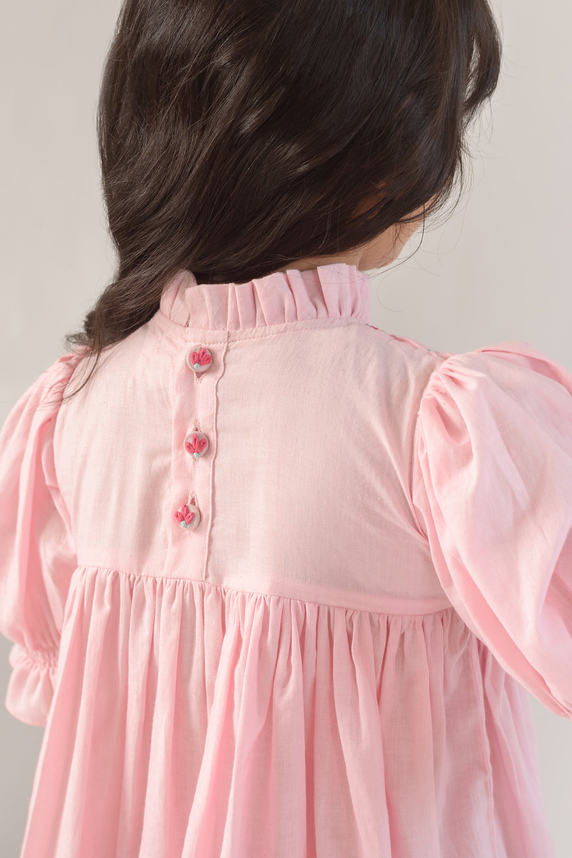 Valley of Flowers is a Thread Embroidered Organic Cotton Pink Dress For Girls.