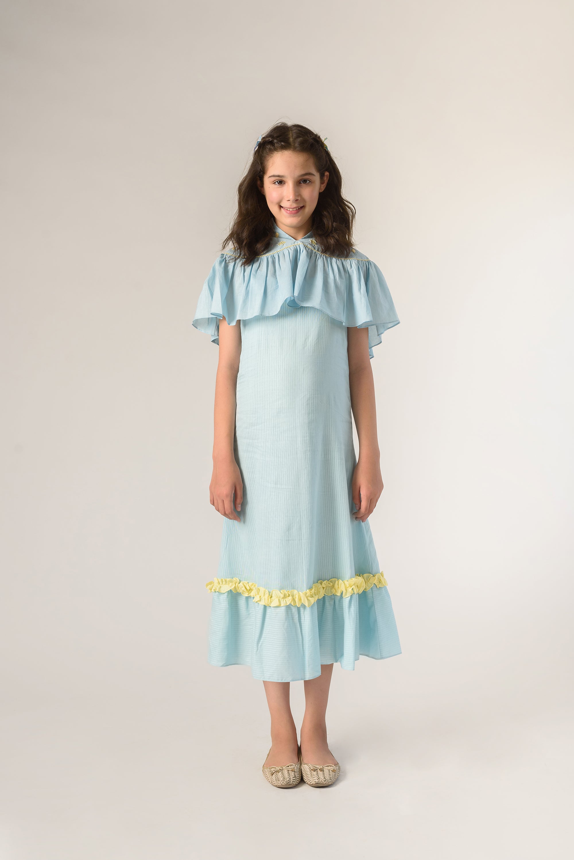 Days of tranquil is a Blue Color Organic Cotton Slip Dress With Embroidered Cape For Girls.