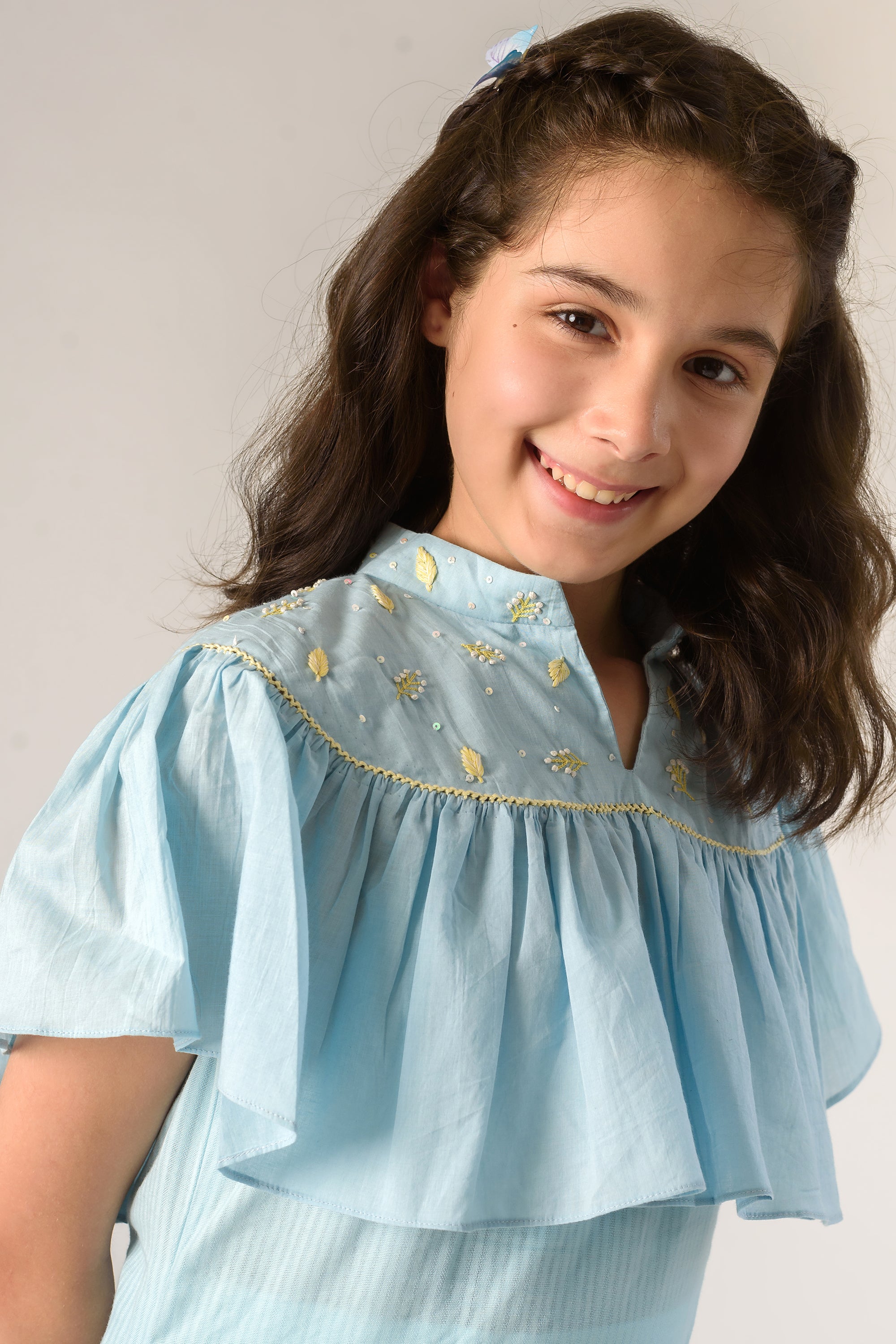 Days of tranquil is a Blue Color Organic Cotton Slip Dress With Embroidered Cape For Girls.