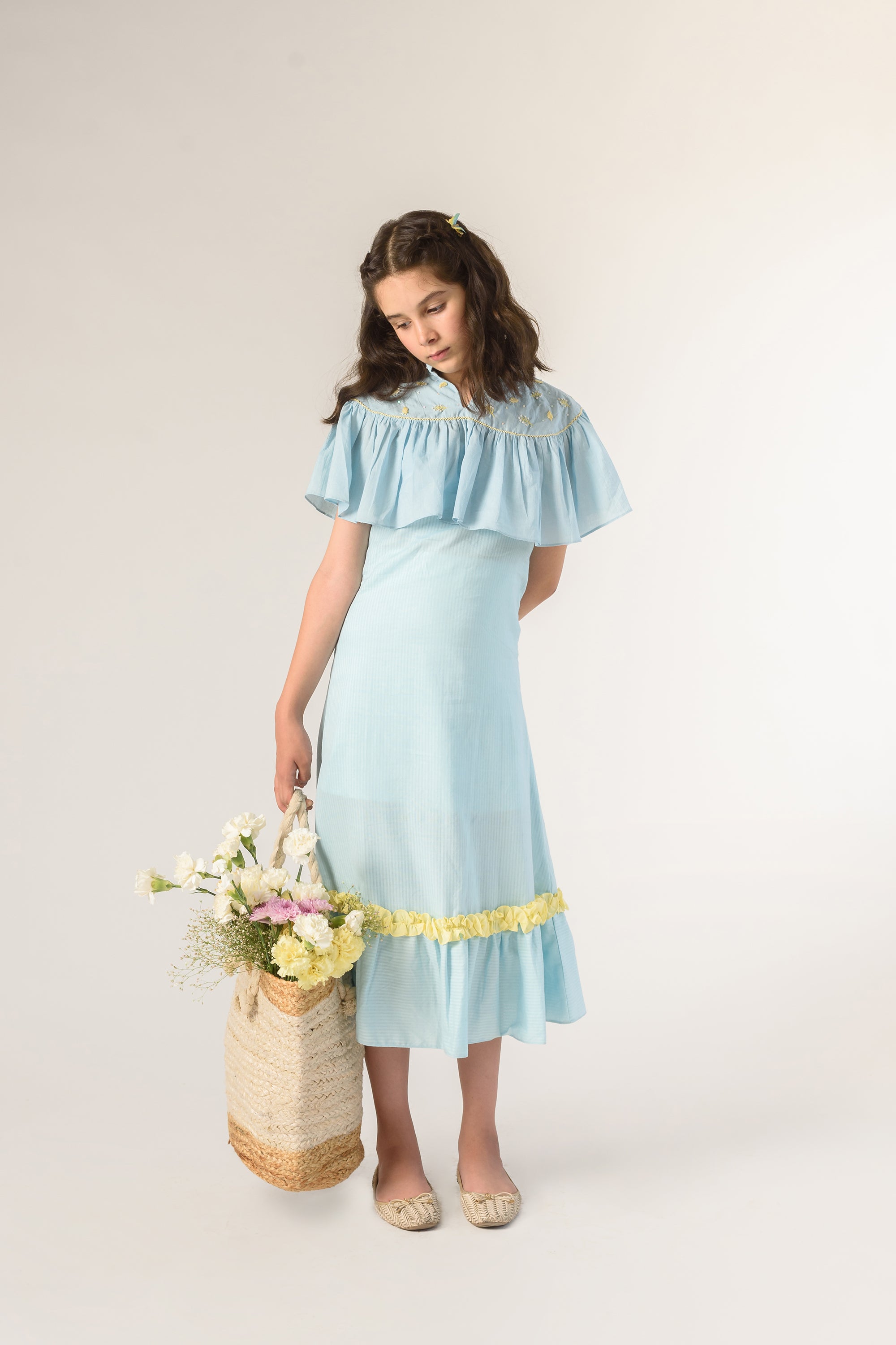 Days of tranquil is a Blue Color Organic Cotton Slip Dress With Embroidered Cape For Girls.