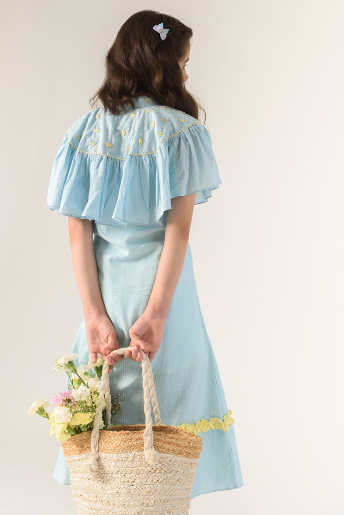 Days of tranquil is a Blue Color Organic Cotton Slip Dress With Embroidered Cape For Girls.