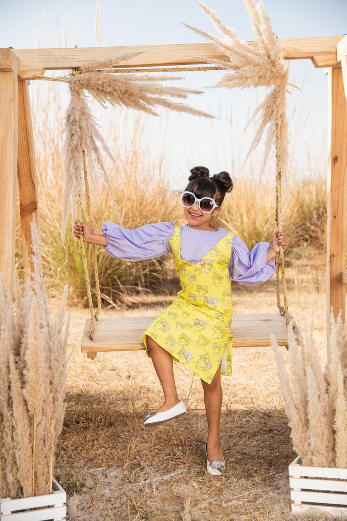 Reel-to-reel is an Organic Cotton Gamboling Cassette Pinafore Dress For Girls.