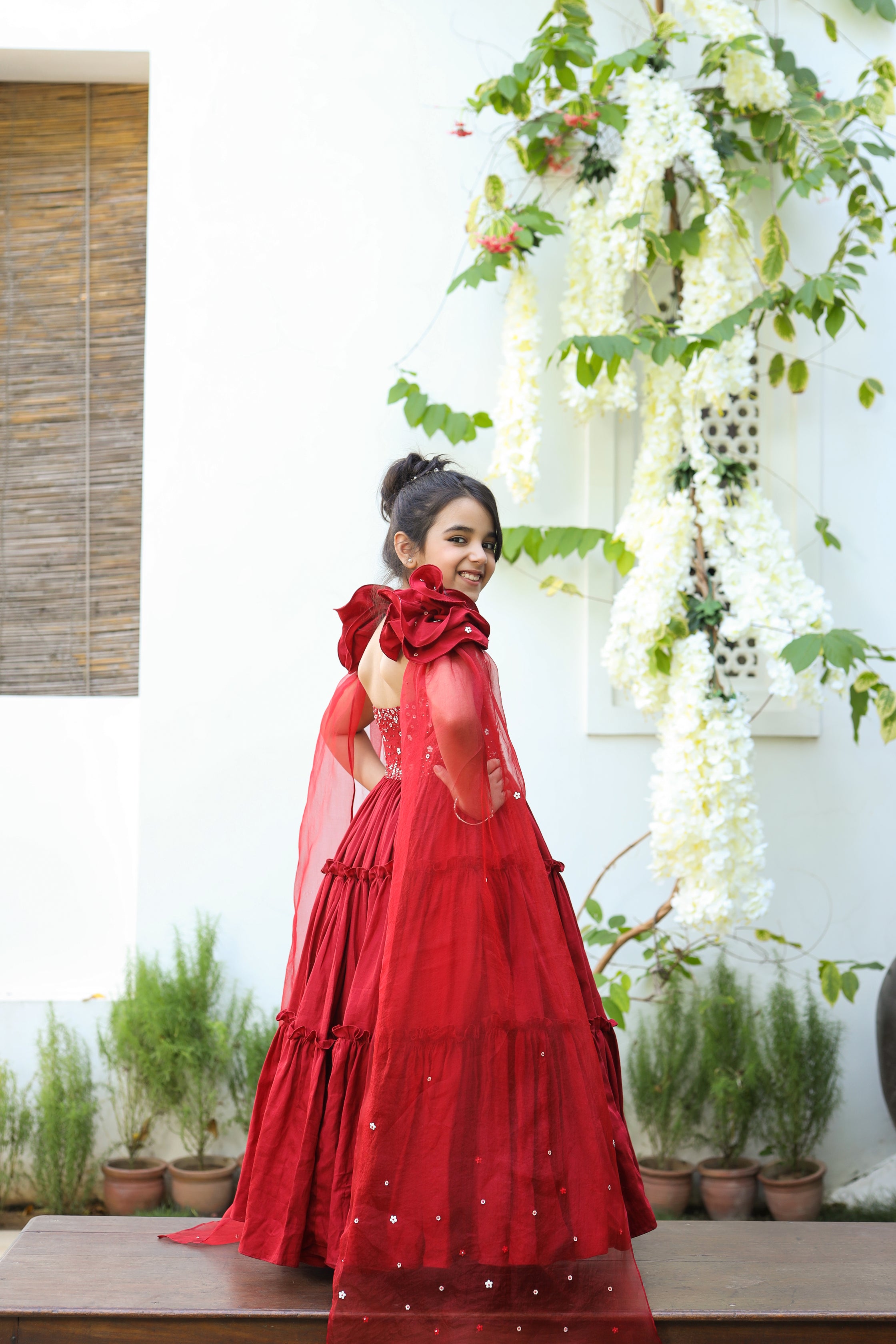 Aita is a red color Organic Vegan Silk Tiered Gown with Draped Dupatta for Girls.