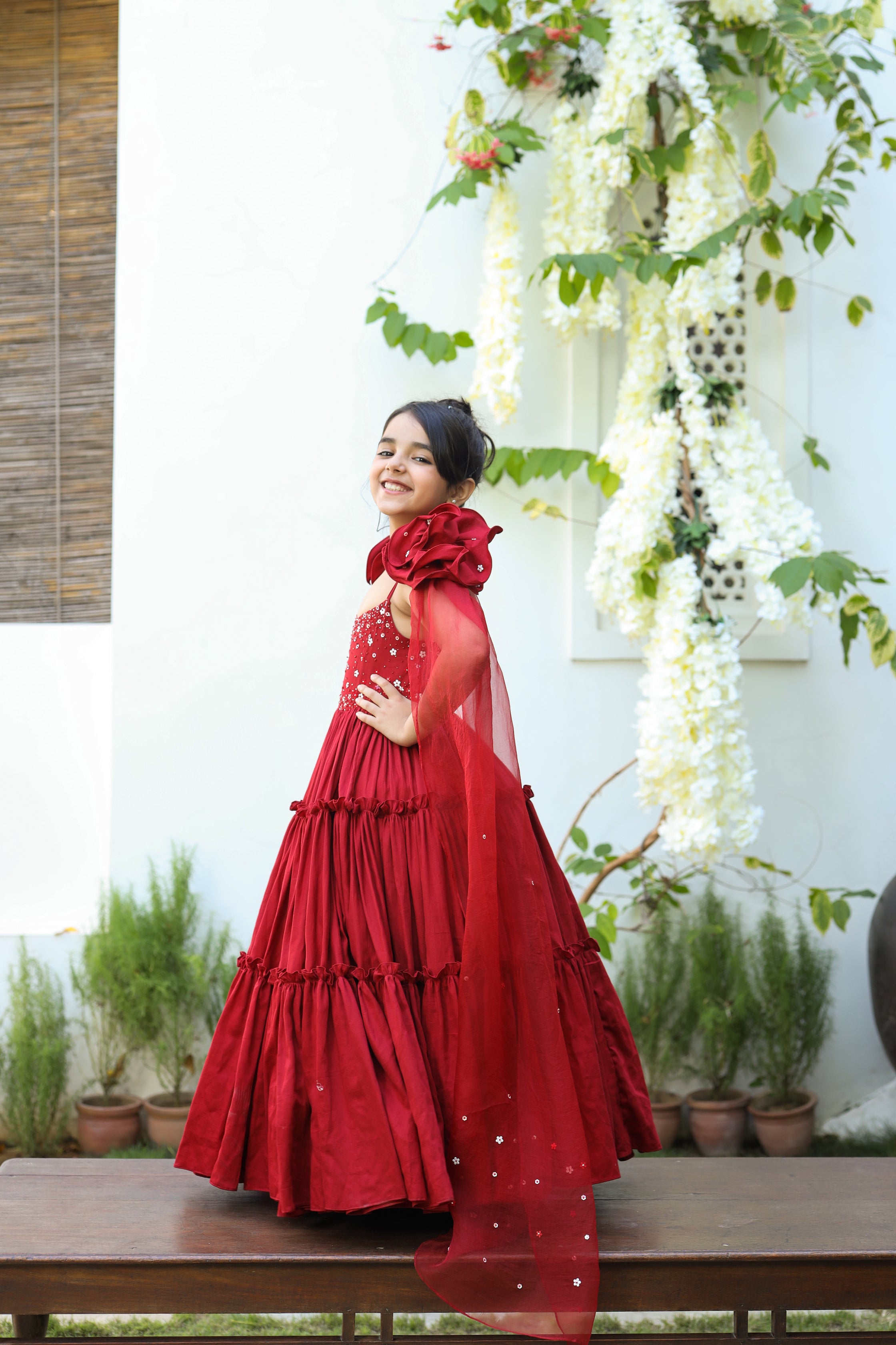 Aita is a red color Organic Vegan Silk Tiered Gown with Draped Dupatta for Girls.