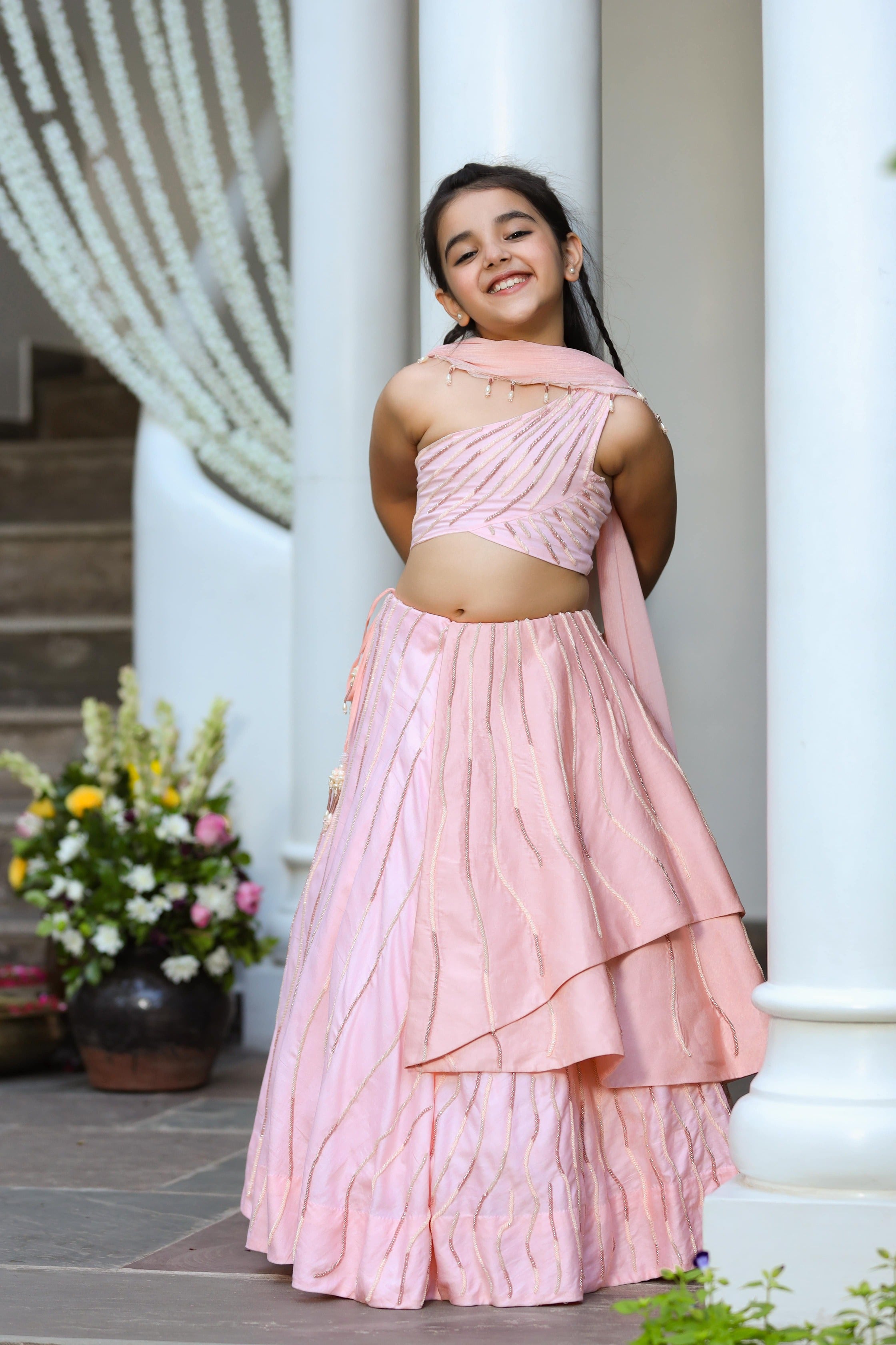 Khwabeeda is an Embroidered Three-Piece Lehenga Set For Girls.