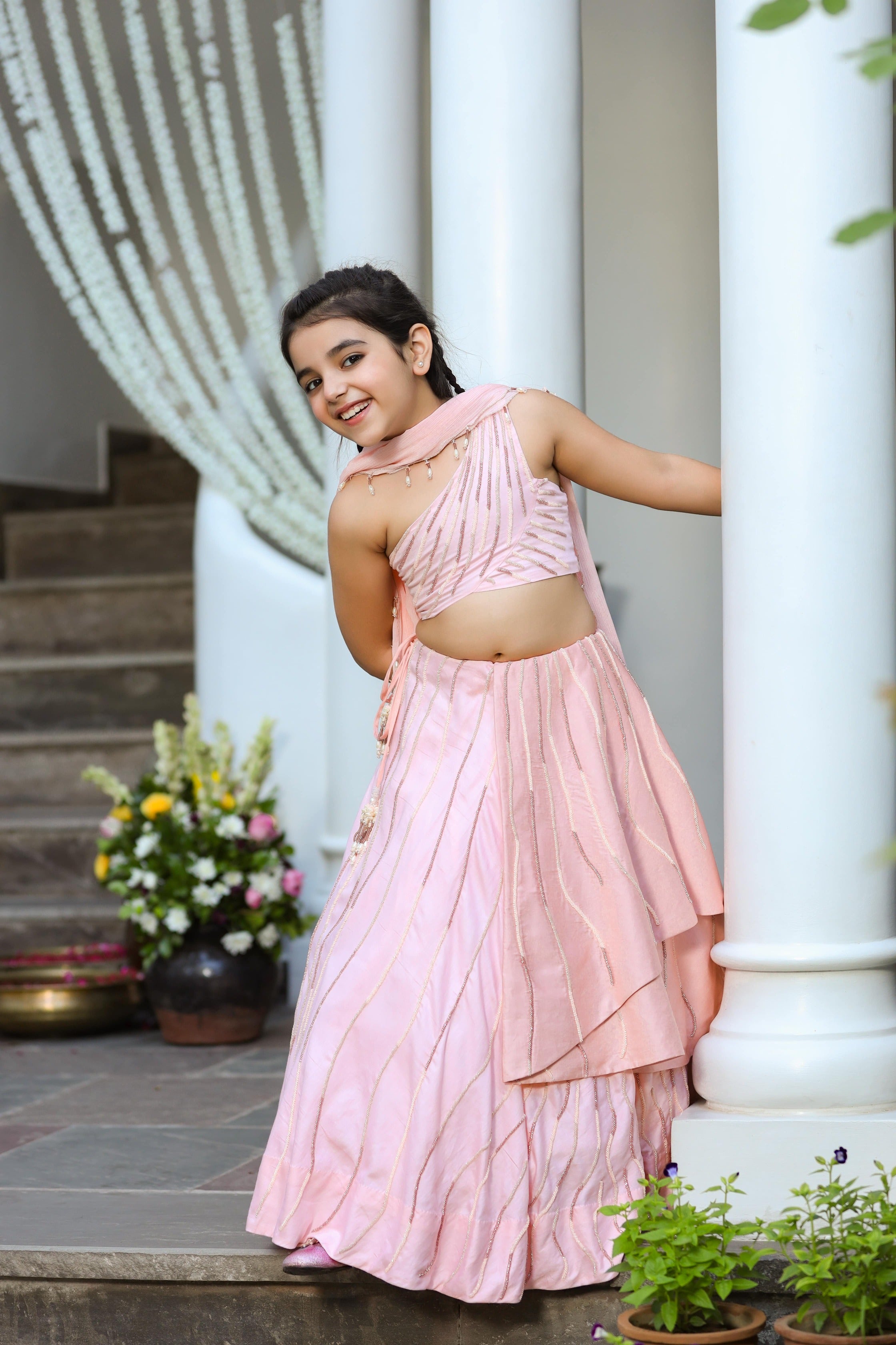 Khwabeeda is an Embroidered Three-Piece Lehenga Set For Girls.