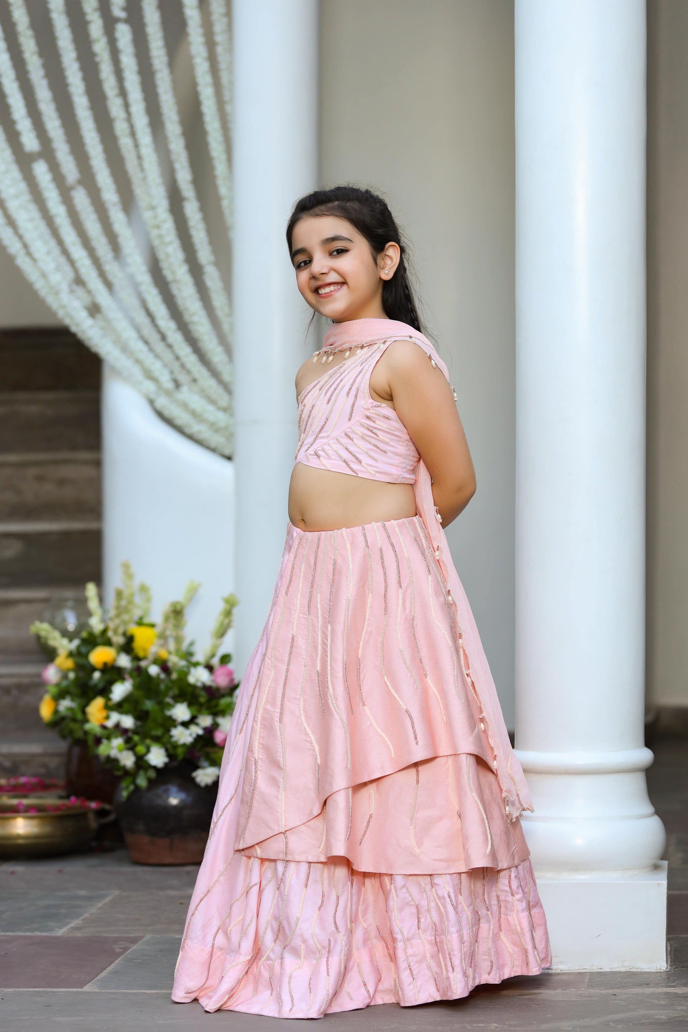 Khwabeeda is an Embroidered Three-Piece Lehenga Set For Girls.