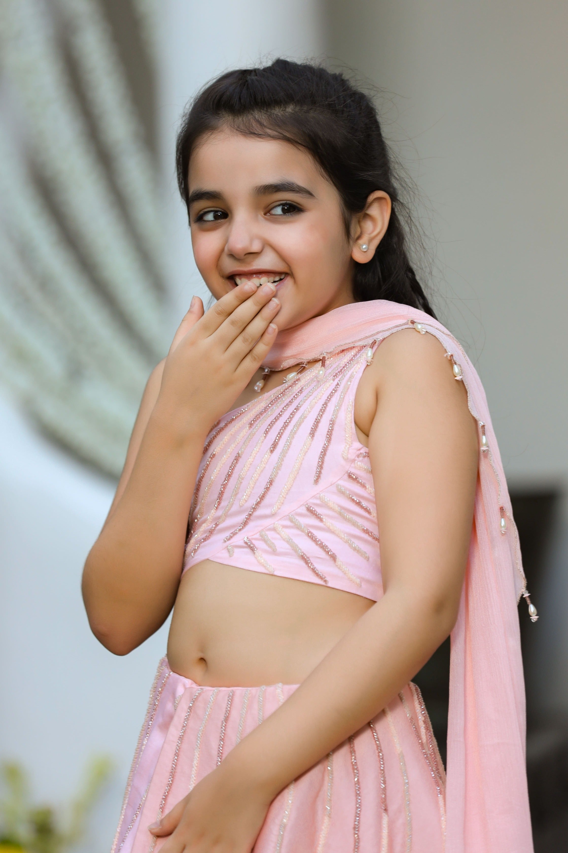 Khwabeeda is an Embroidered Three-Piece Lehenga Set For Girls.