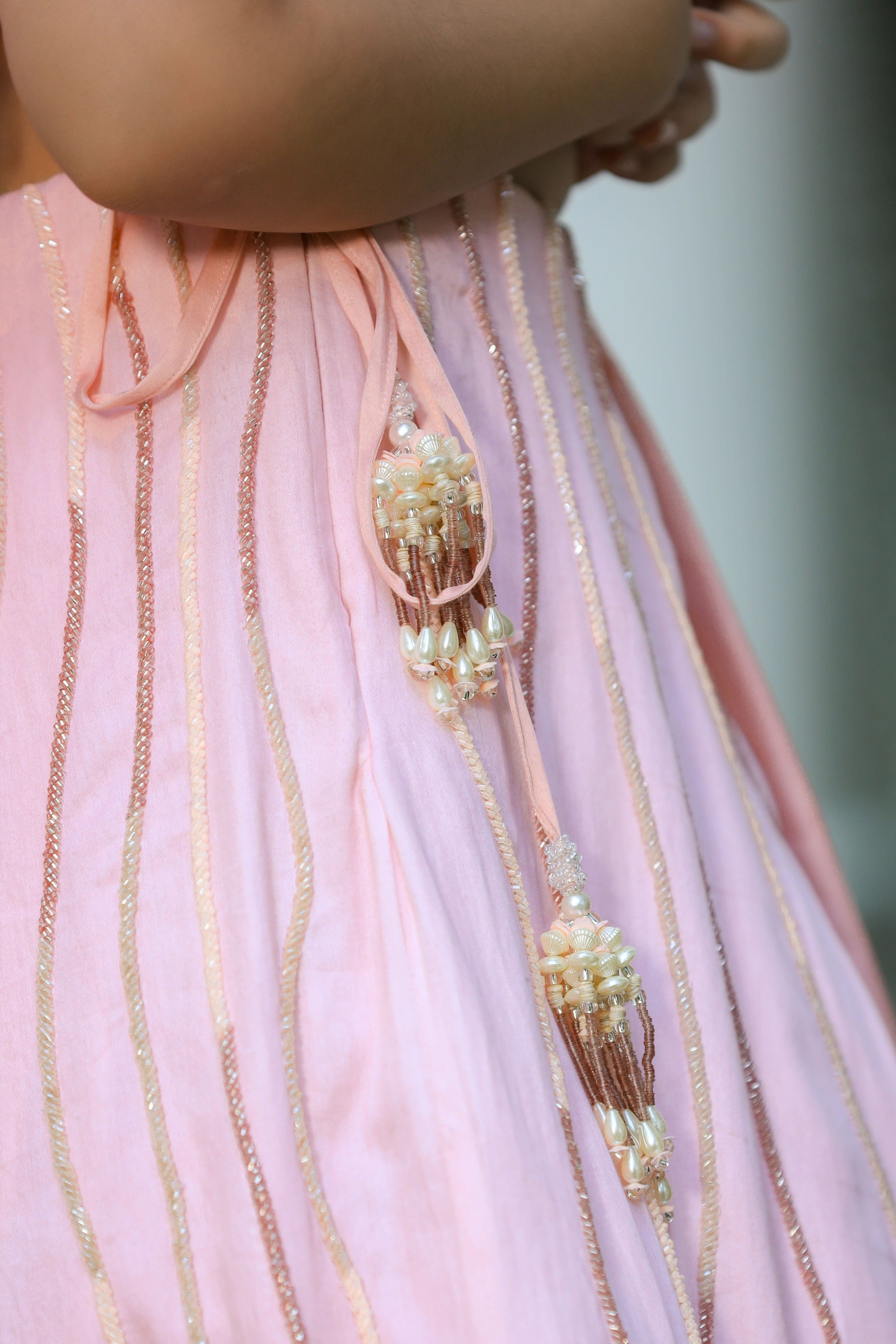Khwabeeda is an Embroidered Three-Piece Lehenga Set For Girls.