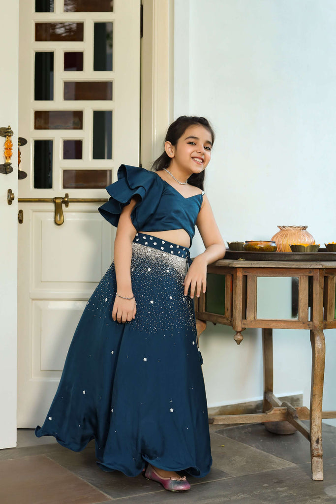 Mahtab is an Embroidered German Satin Skirt and Ruffled Top Set For Girls.