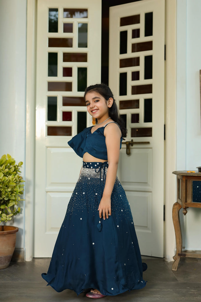 Mahtab is an Embroidered German Satin Skirt and Ruffled Top Set For Girls.